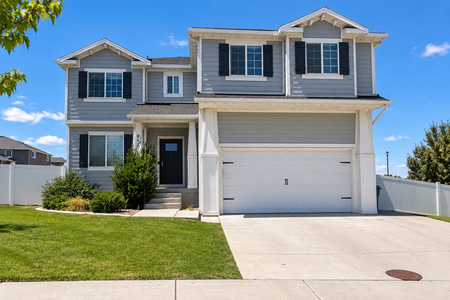 Front exterior of 941 N Stallion Drive with its two-car garage